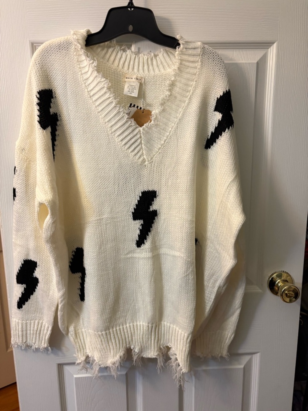Main Strip White V-Neck Sweater with Black Lightning Bolts